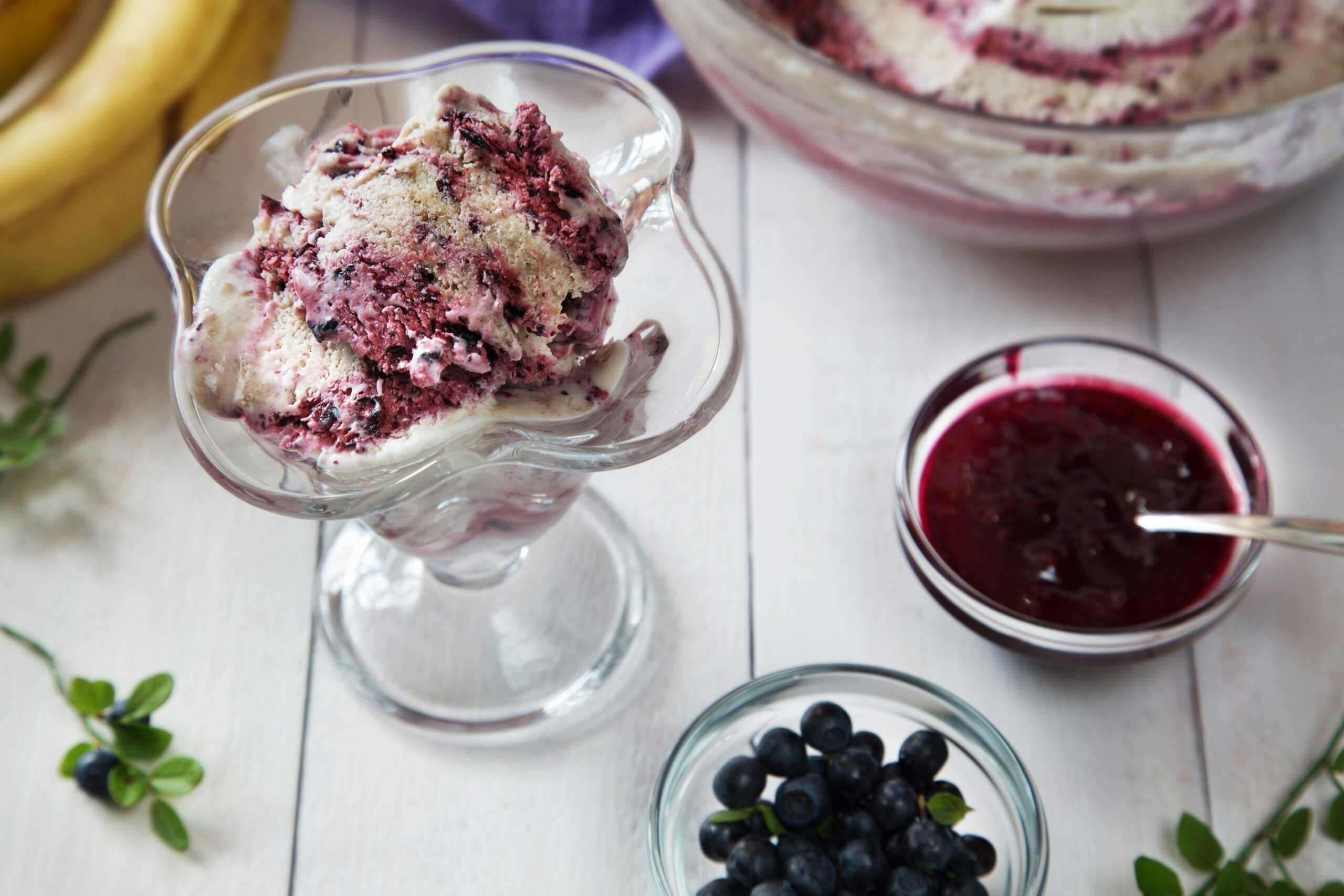 Blueberry ice cream sundae is a delicious dessert.